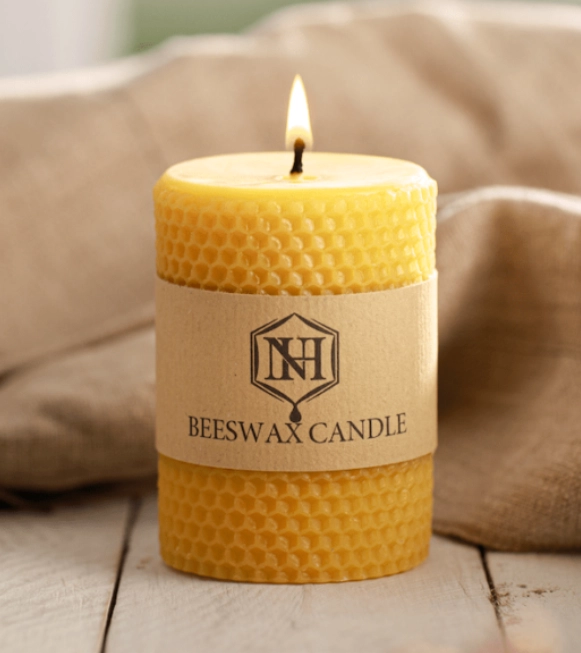 Natural beeswax candle with soft amber glow for a calming bedtime routine and better sleep