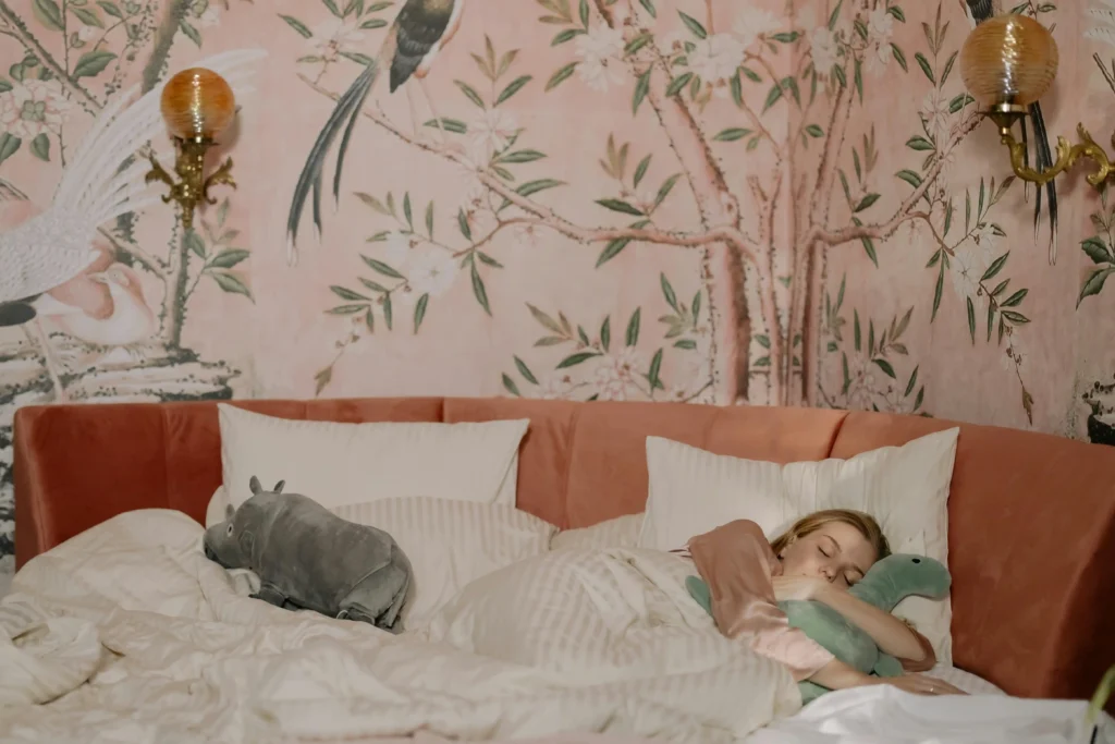 Person taking a short daytime nap in bed to restore energy and support better sleep for busy professionals